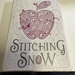 Stitching Snow Hardcover Book